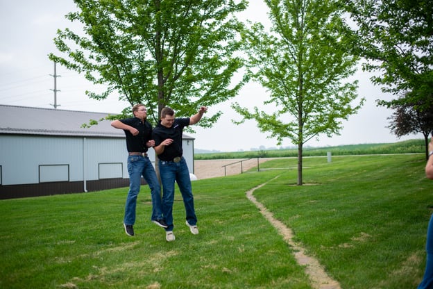 Interns jumping to shoulder bump